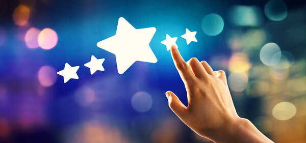 Five star rating with hand pressing a button