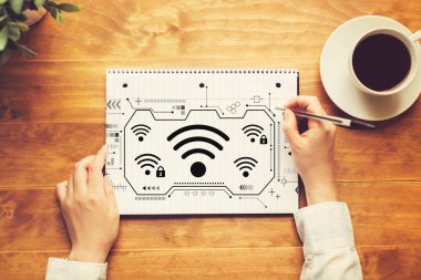 Wifi with a person writing in a notebook