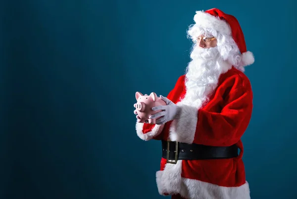 Santa in possesso di un salvadanaio — Foto Stock