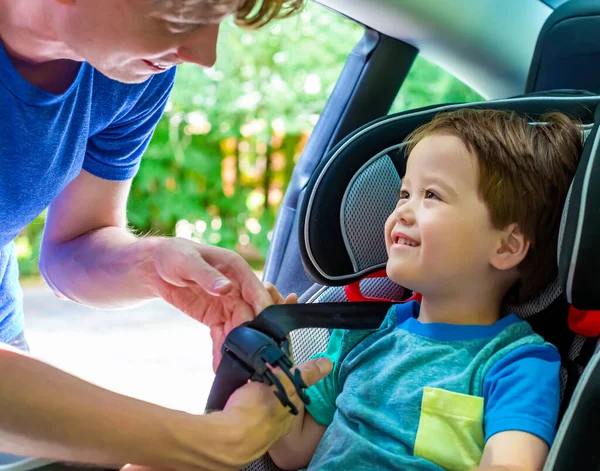 Toddler boy buckled into his car seat — Stock Photo, Image