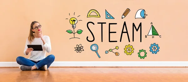 STEAM with woman using a tablet