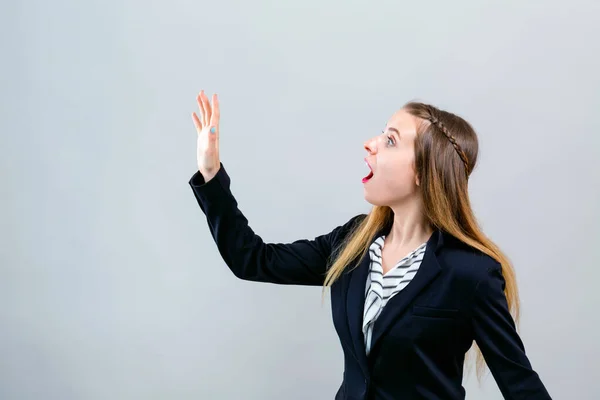 Surprised young woman posing — Stock Photo, Image