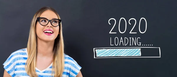 Loading new year 2020 with happy young woman — Stock Photo, Image