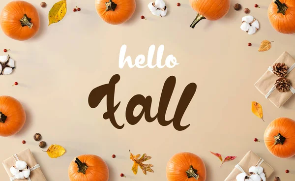 Hello fall message with autumn pumpkins with present boxes