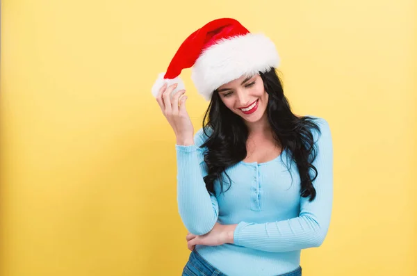 Happy woman with a Santa hat — Stock Photo, Image