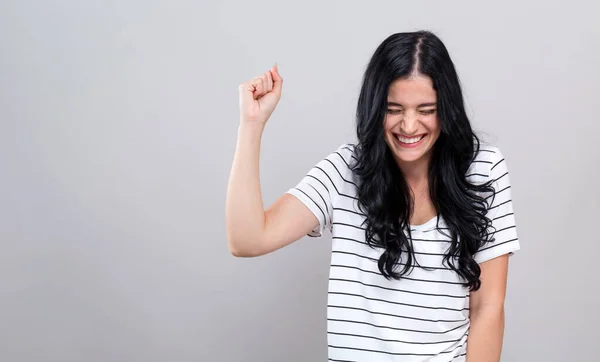 Young woman making a yay gesture — Stock Photo, Image
