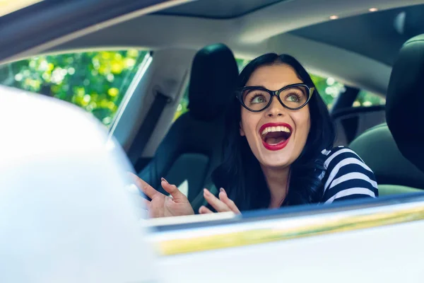 Woman in an autonomous vehicle