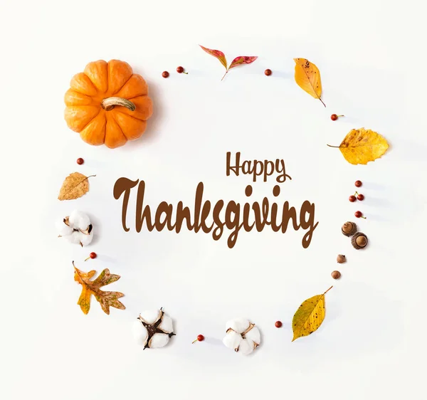 Thanksgiving message with autumn leaves and orange pumpkin — Stock Photo, Image