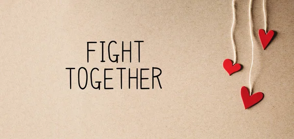 Luchar juntos mensaje con corazones pequeños —  Fotos de Stock
