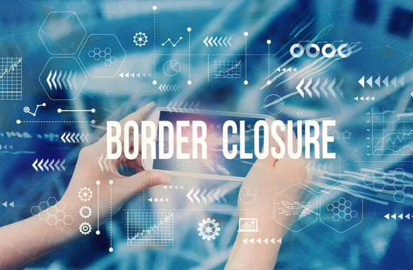 Border Closure Theme with person using smartphone — Stock Photo, Image