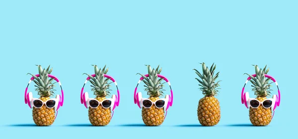 One out unique pineapple wearing headphones — Stock Photo, Image