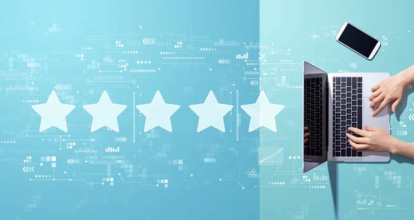 Rating star concept with person working with laptop — Stock Photo, Image