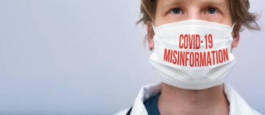 Covid-19 Misinformation theme with person wearing a protective face mask clipart