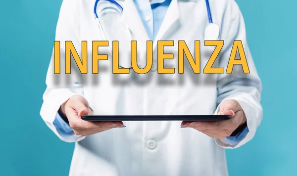 Influenza thema met een arts die een tablet pc gebruikt — Stockfoto
