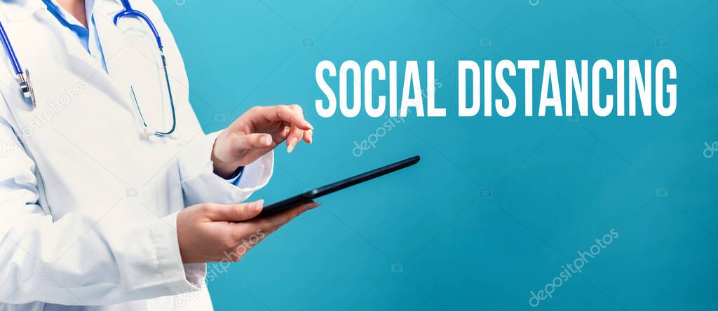 Social Distancing theme with a doctor using a tablet