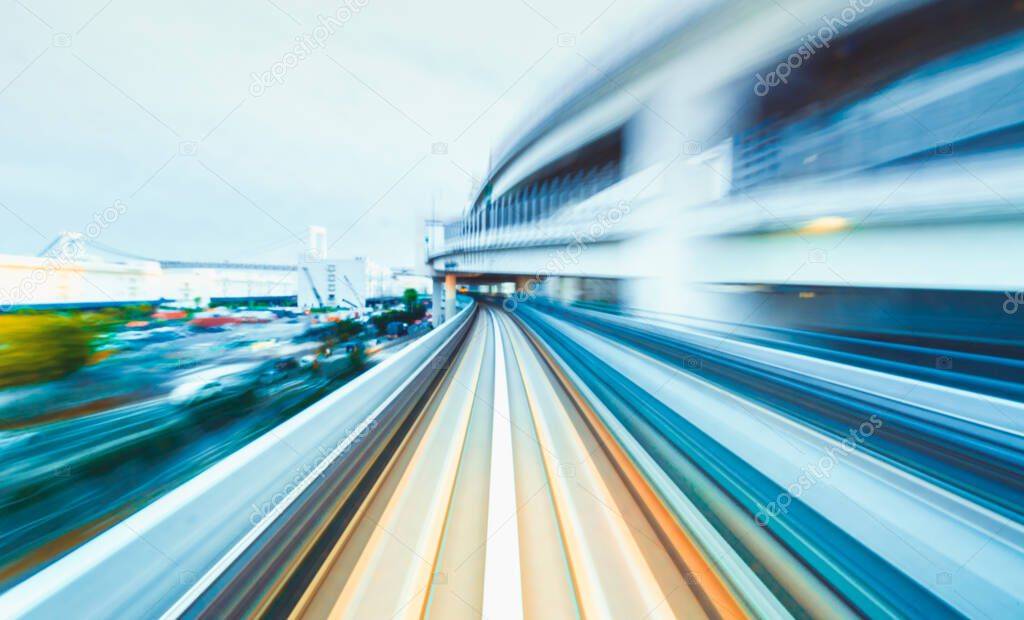 POV train motion blurred concept from the Yuikamome monorail in Tokyo, Japan