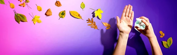 Applying sanitizer gel with autumn leaves — Stock Photo, Image