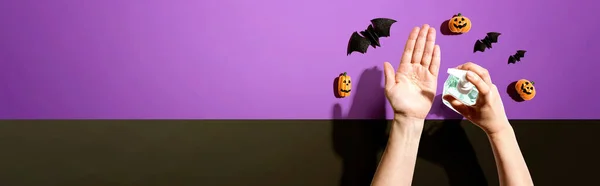 Applying sanitizer gel with Halloween theme — Stock Photo, Image