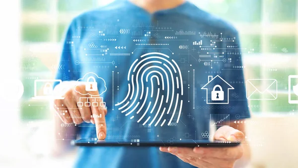 Fingerprint scanning theme with man using a tablet — Stock Photo, Image