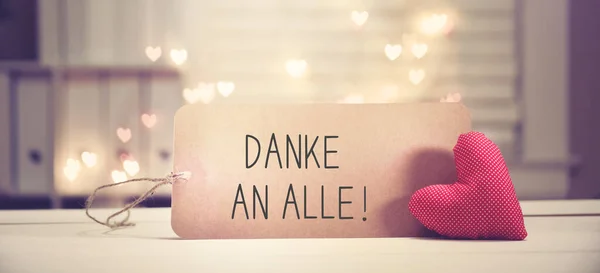 Danke an alle - Thank you all in German language with a red heart