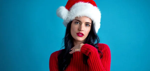 Young woman with Santa hat thoughtful pose — Stock Photo, Image