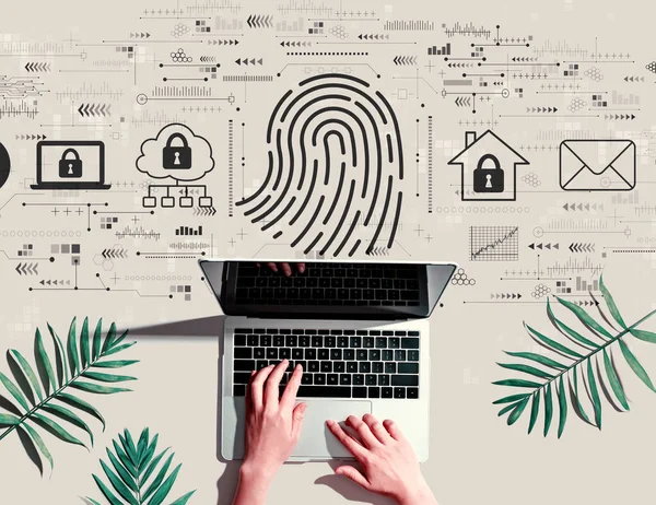 Fingerprint scanning theme with person using a laptop — Stock Photo, Image
