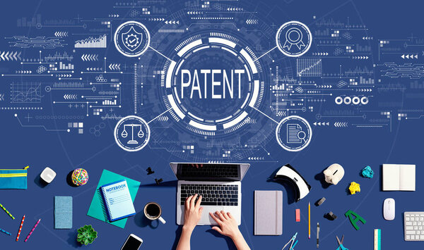 Patent concept with person using a laptop