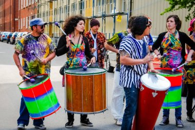 Men playing African drums at a carnival in Malm, Sweden 2010