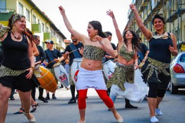 A white dressed woman participating in a carnival in Malm, Sweden, 2010