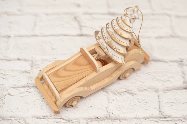 handmade wooden toy car with small Christmas tree