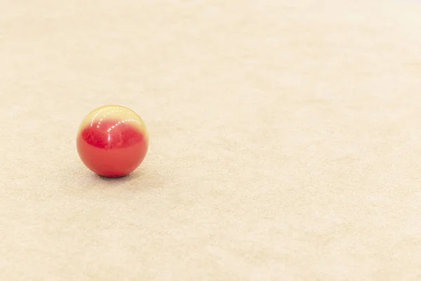 red small ball on light background