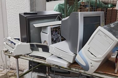 electronic waste: old computers, monitors, televisions and other devices to recycle clipart