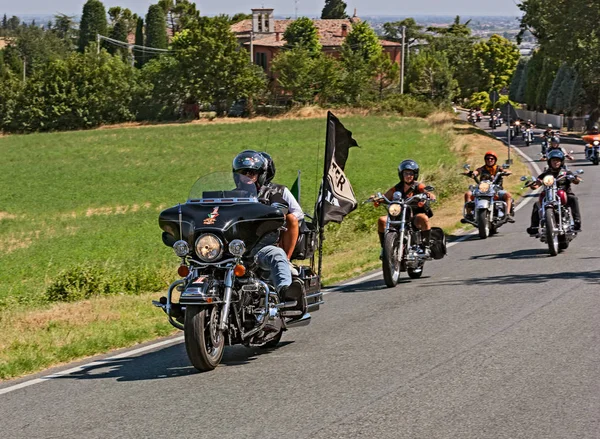 group of bikers riding American motorbikes Harley Davidson in motorcycle rally 