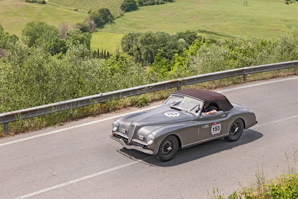 classic sport car Alfa Romeo 6C 2300 B MM spider Touring (1947) runs in the Tuscan country, in historical race Mille Miglia, on May 17, 2014 in Colle di Val d'Elsa, SI, Italy