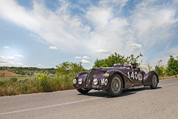 vintage sport car Alfa Romeo 6C 2300 B MM spider Touring (1938) runs in the Tuscan country, in historical race Mille Miglia, on May 17, 2014 in Colle di Val d'Elsa, SI, Italy