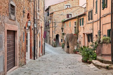Castagneto Carducci, Leghorn, Tuscany, Italy: ancient street in the old town of Castagneto Carducci, the village where he lived the poet Giosue Carducci clipart