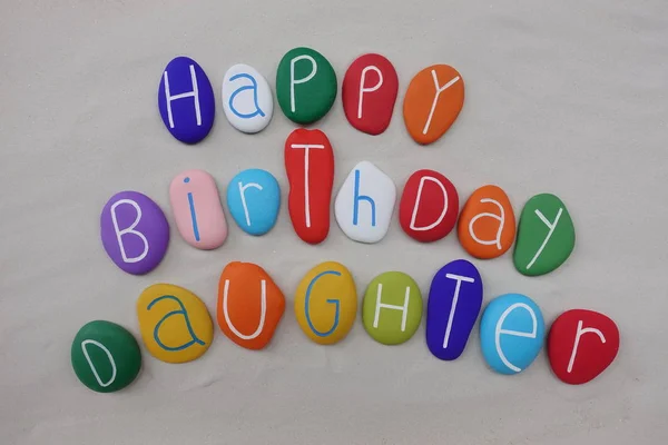 Happy Birthday Daughter with colored stones over white sand