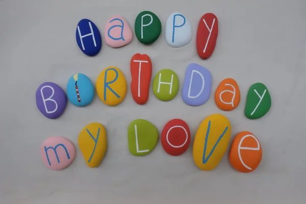 Renkli taşların üzerinde beyaz kum mutlu Doğum My Love