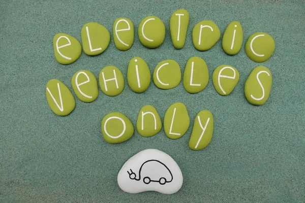 Electric Vehicles Only text with green colored stones over green sand