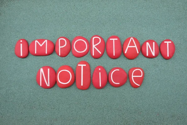 Important Notice Text Composed Red Colored Stone Letters Green Sand — Stock Photo, Image