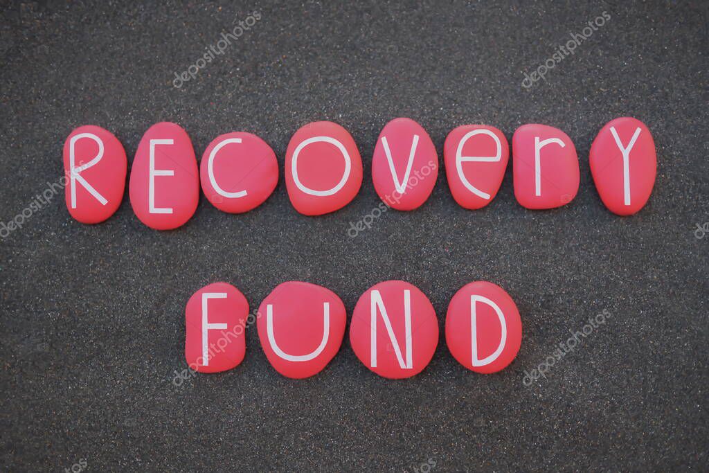 Recovery fund, economical recovery instrument text composed with red colored stone letters over black volcanic sand