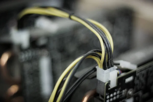 abandoned bitcoin mining equipment, in dust, defocused, close up