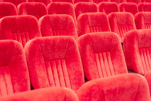 empty assembly hall with red chairs in rows. concept of trainings, business meetings and conferences.for decor and design background texture.