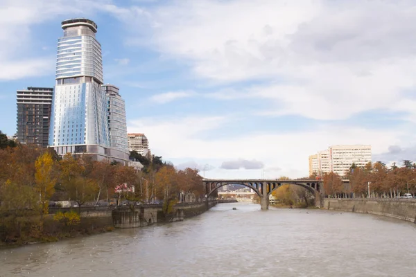 King David Residence & Business Center in the center of Tbilisi. A modern building overlooking the Kura River and the bridge.