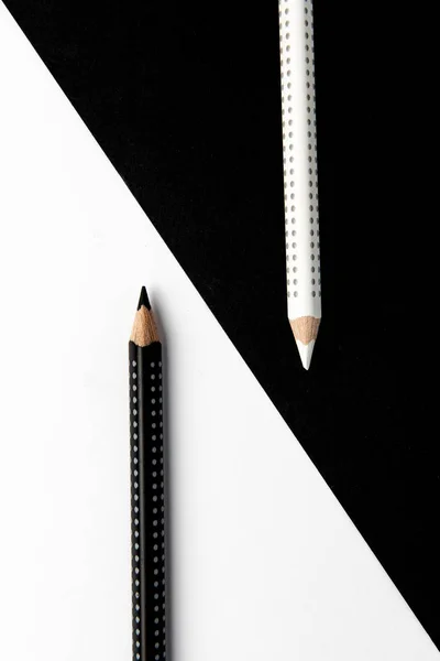Two drawing pencils on a black and white surface. — Stock Photo, Image