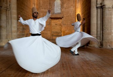 Dervishes performing the traditional religious whirling dance clipart