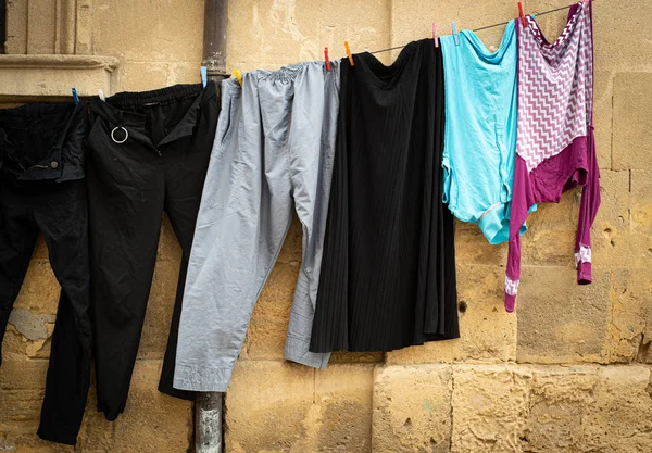 Laundry hanging on a rope and drying outdoor in the clean air — Stock Photo, Image
