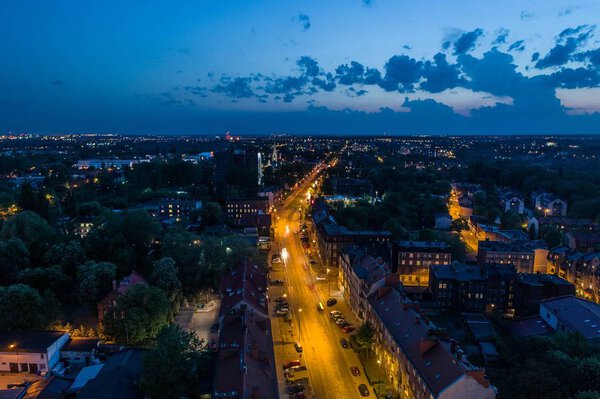 Aerial drone view on night street in Zabrze city. Zabrze, Silesia, Poland