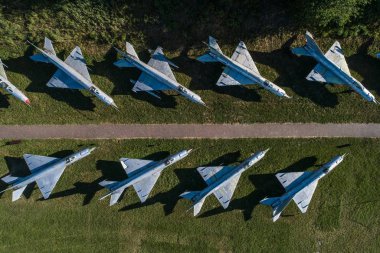 Aerial drone view on military airbase with old Russian jet fighters. Airplanes cemetery clipart