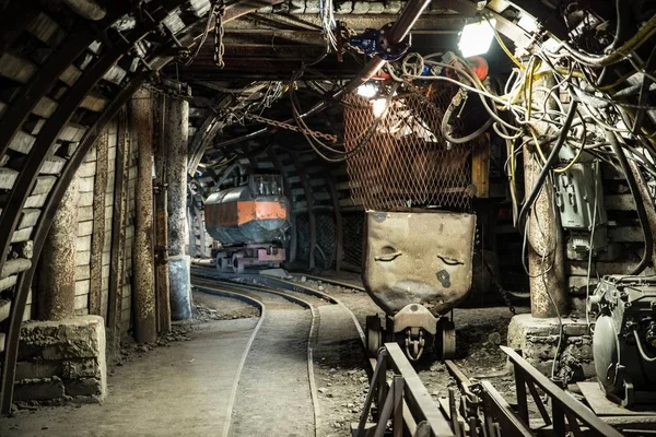 Coal wagons on a tracks in an underground coal mine